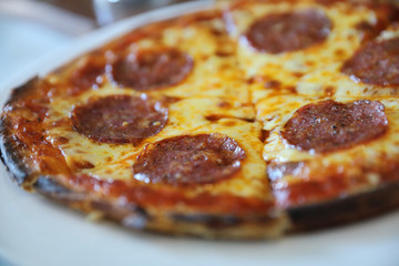 pepperoni pizza on dish , italian food
