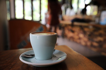 cappuccino or Latte art coffee made from milk on the wood table in coffee shop