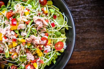 Tuna salad bowl with vegetables in the big plate.