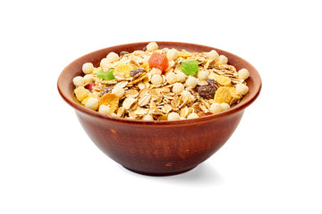 Bowl of muesli with dried exotic fruits on white