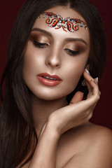 Beautiful girl with creative arab makeup, straight long hair and perfect skin. Beauty face. Photos shot in studio