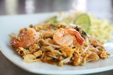 Shrimp pad thai noodles with shrimps on top , Thai food
