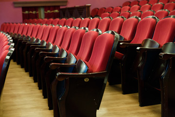 theater hall for visitors with beautiful chairs of Burgundy-red velvet chairs before the show