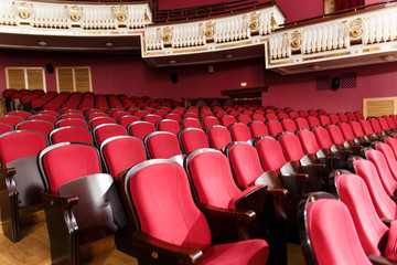 theater hall for visitors with beautiful chairs of Burgundy-red velvet chairs before the show
