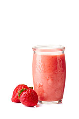 Yogurt and strawberry smoothie in jar on white
