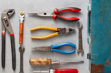 Set of different construction vintage tools and instruments for household with old iron box