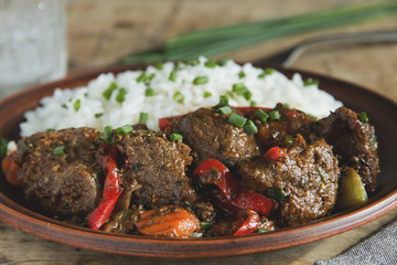 fried roast beef stew with vegetables and rice
