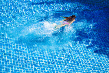 Woman swimmer in the swimming pool 