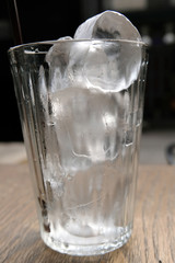 close-up glass of ice on table
