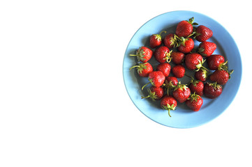 Strawberry in plate on white background close-up