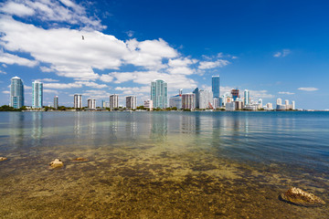 Beautiful Miami skyline along Biscayne Bay with tall Brickell Avenue condos and office buildings.