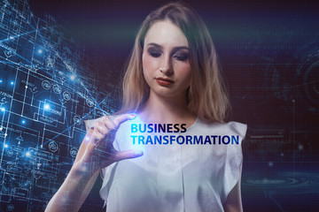 The concept of business, technology, the Internet and the network. A young entrepreneur working on a virtual screen of the future and sees the inscription: Business transformation