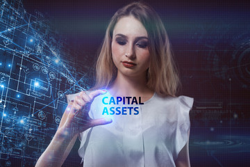 The concept of business, technology, the Internet and the network. A young entrepreneur working on a virtual screen of the future and sees the inscription: Capital assets