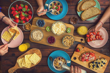 Young Happy Family Having Breakfast