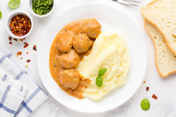 Meatballs with mashed potatoes, creamy tomato sauce, classic delicious food