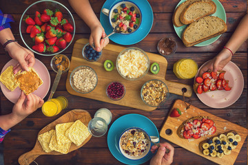 Young Happy Family Having Breakfast