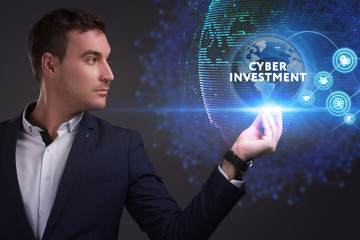 Business, Technology, Internet and network concept. Young businessman working on a virtual screen of the future and sees the inscription: Cyber investment