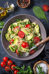 Quinoa salad with spinach, avocado and tomatoes