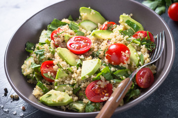 Quinoa salad with spinach, avocado and tomatoes