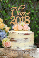 Obraz na płótnie Canvas Soft white yellow graduation cake tart for farewell graduation party class of 2018