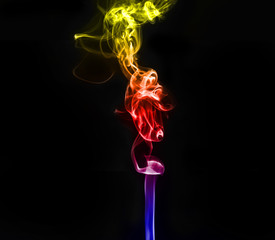 abstract fragment movement of colorful red blue and yellow gradient smoke on black background.
