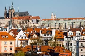 Fototapeta na wymiar Scenic panorama of the old town architecture and buildings with orange roofs in Prague, Czech Republic