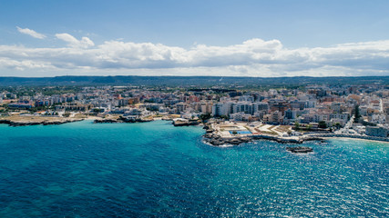 Fototapeta na wymiar White city near blue the Sea Monopoli Apulia Coastline blue in Italy Drone 360 vr
