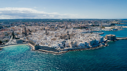 Naklejka premium White city near blue the Sea Monopoli Apulia Coastline blue in Italy Drone 360 vr