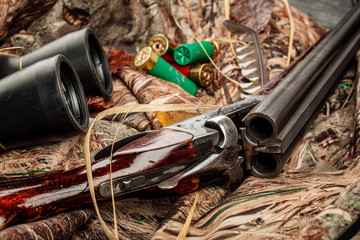 Hunting equipment on the wooden background. Hunt concept.