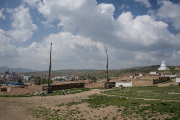 The area of ​​the hill at the temple of Milarepa with flagpoles