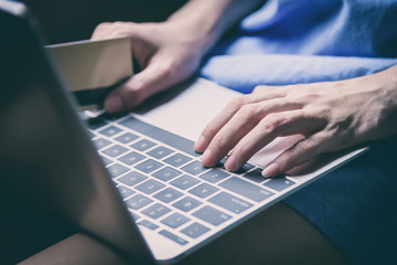 Asian woman traveler has working with laptop and close-up view.