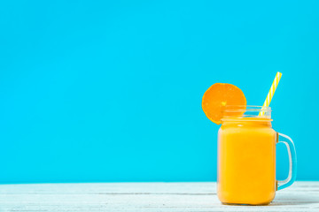 Healthy smoothie with oranges, fruit drink with tropical fruits and orange, summer refreshing dessert and healthy diet concept