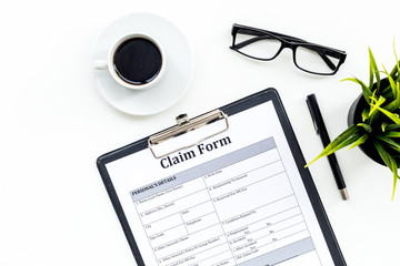 Claim form to fill out on white desk top view