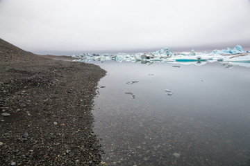 Drift ice flows slowly towards the sea
