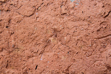 Wall covered with clay close-up. Plaster. Texture. Background.