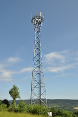 Telecommunication towers on a green hill