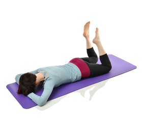 Mother woman exercising doing postnatal workout. Female fitness stretching hands and legs in gym...