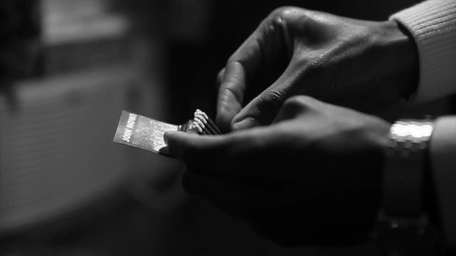 Hands opening a matchbook