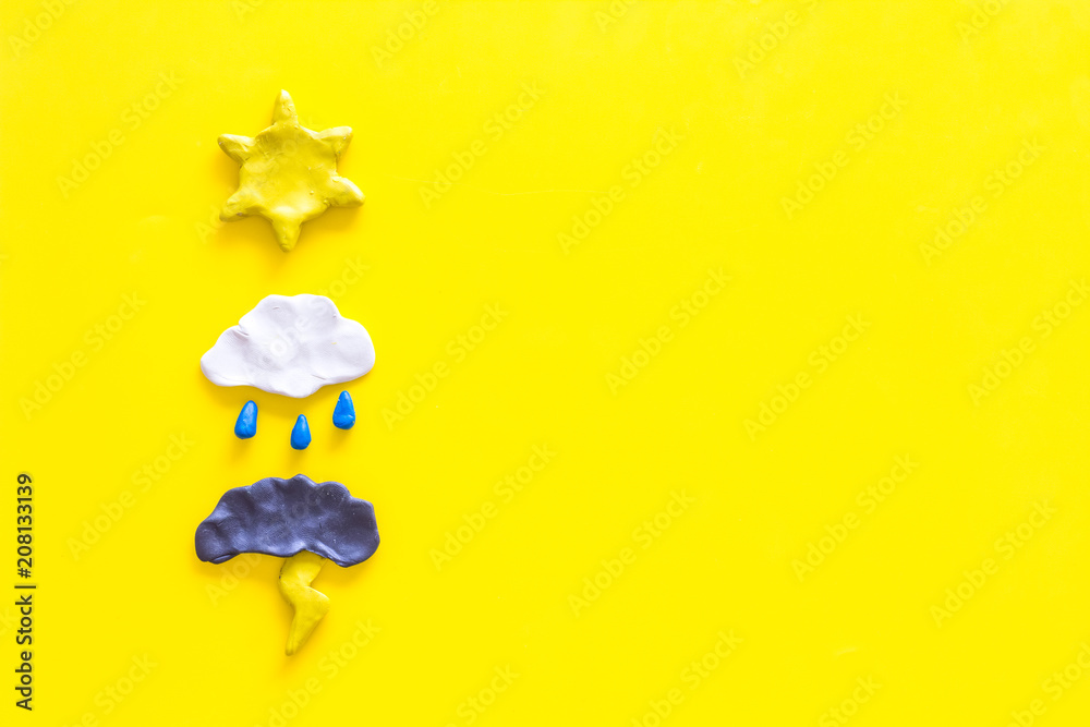 Wall mural weather forecast concept. modern weather icons set on yellow background top view copy space