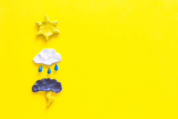 Weather forecast concept. Modern weather icons set on yellow background top view copy space - obrazy, fototapety, plakaty