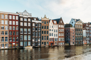 Fototapeta na wymiar Beautiful Architecture Of Dutch Houses On Amsterdam Canal In Autumn