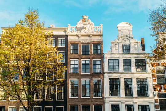 Beautiful Architecture Of Dutch Houses On Amsterdam Canal In Autumn