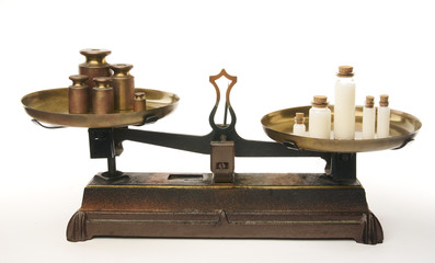 Imbalance of a weight balance in favor of white. Concept of injustice between colors and white. Isolated on black background. With copy space text. Studio Shot.