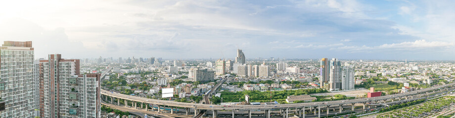 Aerial view of city, Landscape of Bangkok city skyline in Aerial view with skyscraper, modern office building and blue sky with cloudy sky background in Bangna Bangkok, Thailand.