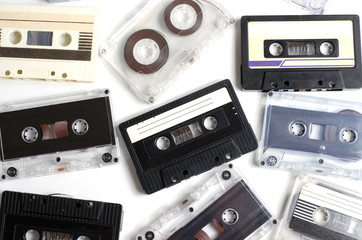 Old audio cassettes on white background