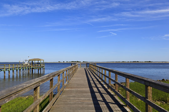 Wood boardwalk at Waterfront Park in Southport, North Carolina in the summer