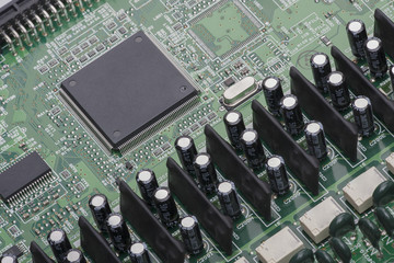 Electronic components are mounted on the device board Chips diodes capacitors chokes Close-up