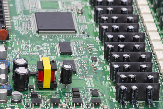 Electronic components are mounted on the device board Chips diodes capacitors chokes Close-up