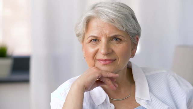 age and people concept - portrait of happy senior woman