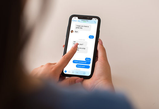Woman using instant messaging app on smartphone